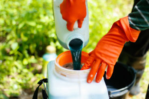 farmer mixing pesticide